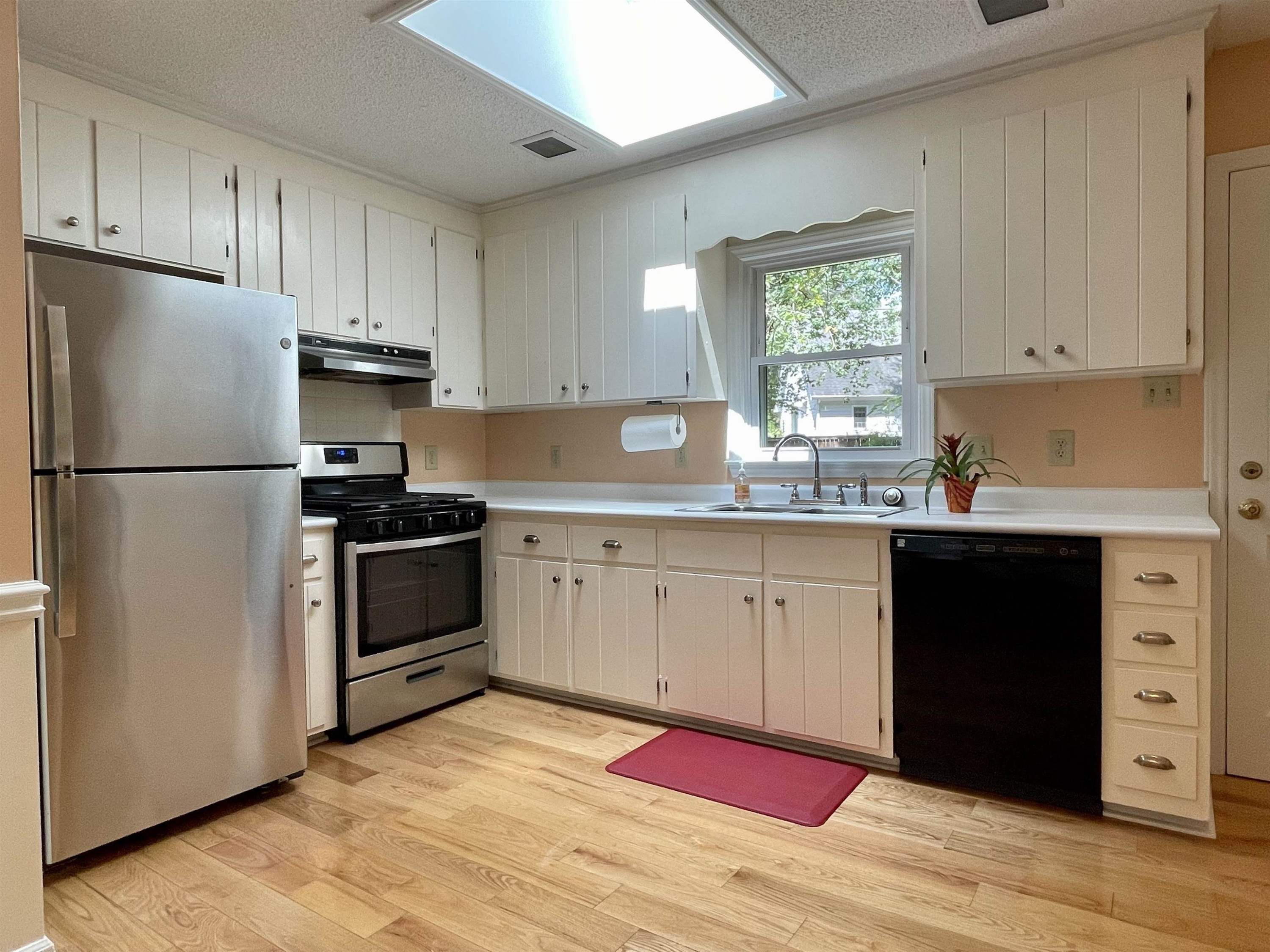 4506 Malvern Road Durham, NC 27707 - Photo 22 of 40 Another view of kitchen. Watch nature as you do the dishes. Skylight makes the room bright.. Kitchen