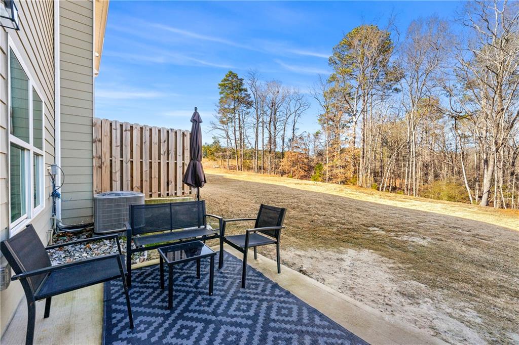 7492 Knoll Hollow Road Lithonia, GA 30058 - Photo 28 of 30 a view of a roof deck with furniture