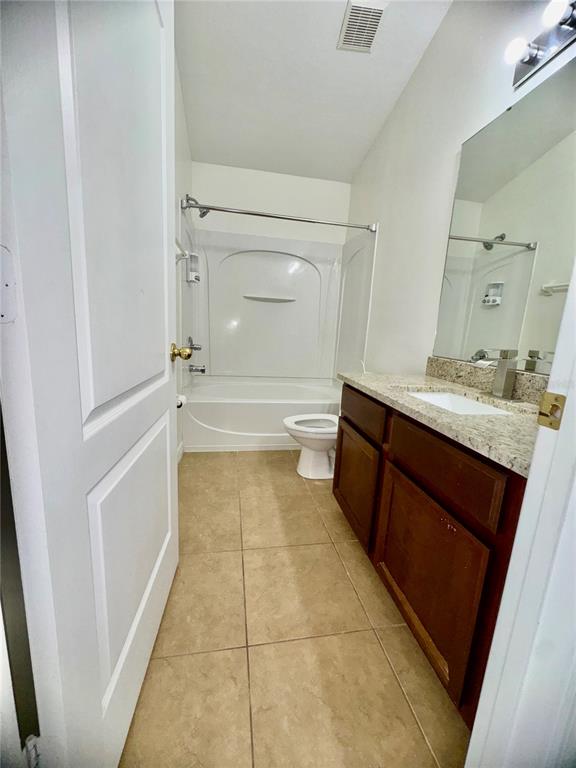 6404 South Goldenrod Road, Unit 2A Orlando, FL 32822 - Photo 17 of 40 a bathroom with a bathtub sink and toilet