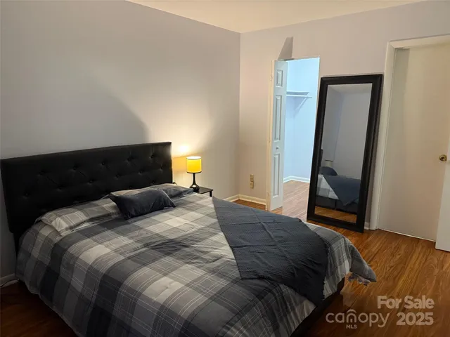 a view of front door with wooden floor