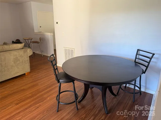 a bedroom with a bed and a mirror