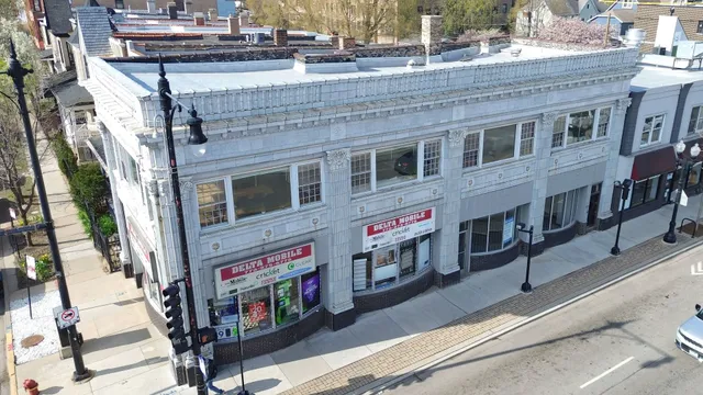 a view of multiple houses with a street