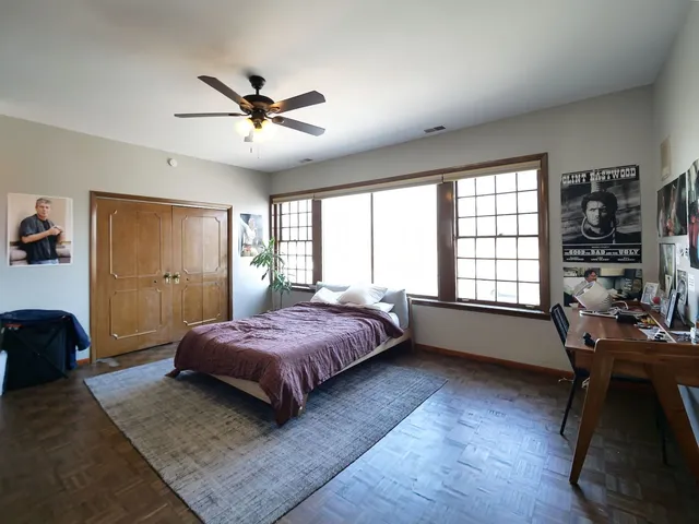 a bedroom with furniture and a fireplace