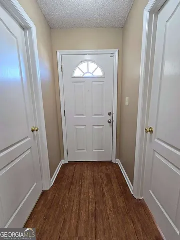 wooden floor in an empty room with closet