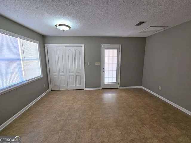 an empty room with windows