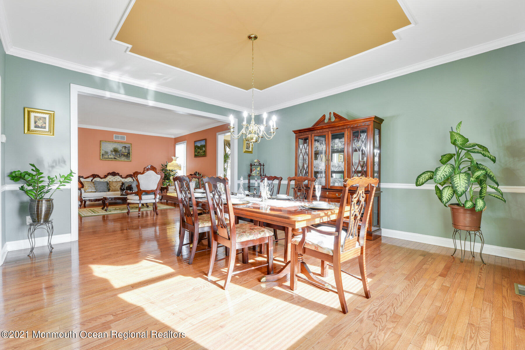 3 Great Bridge Road Freehold, NJ 07728 - Photo 14 of 40 a dining room with furniture potted plants and wooden floor