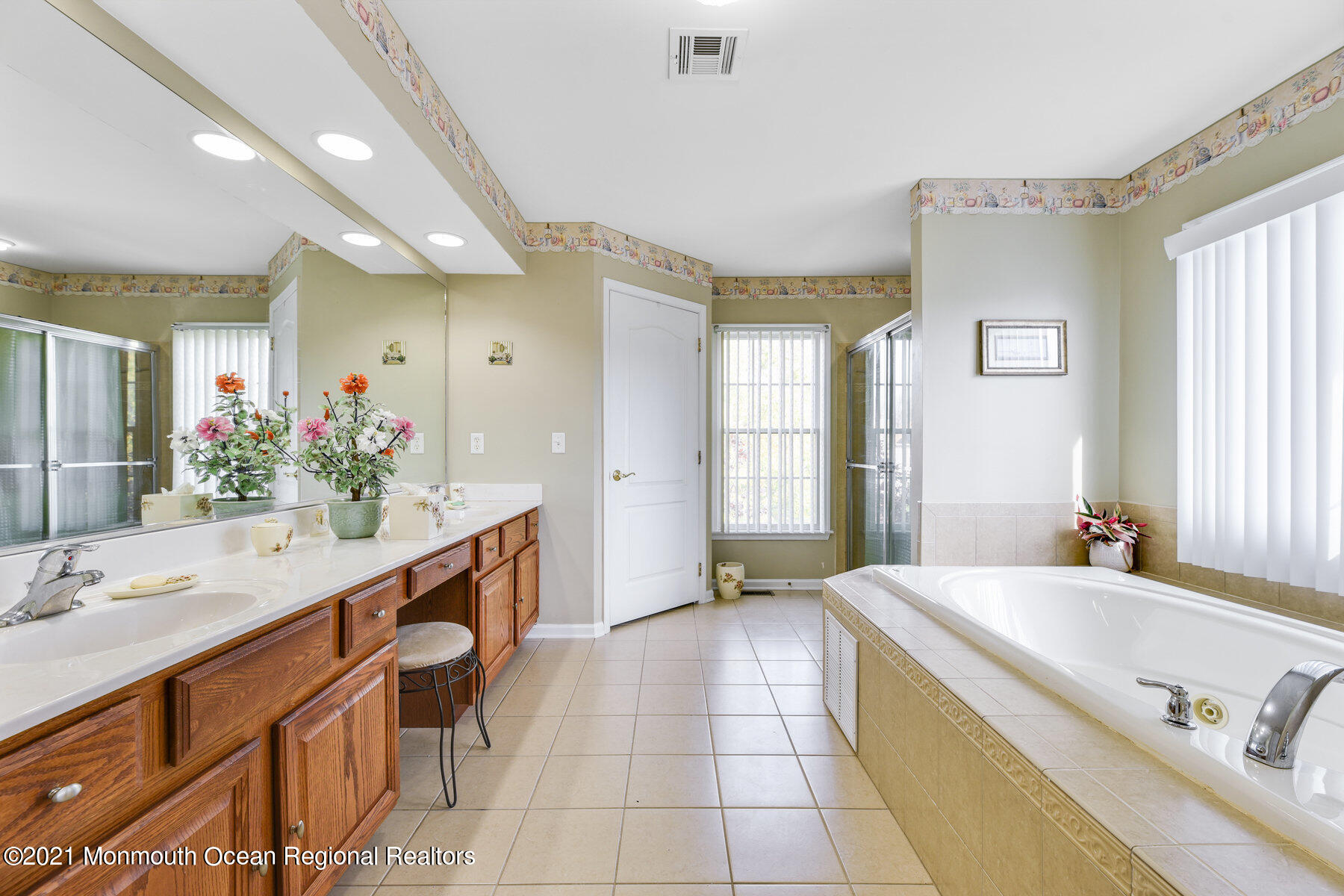 3 Great Bridge Road Freehold, NJ 07728 - Photo 27 of 40 a spacious bathroom with a granite countertop sink a mirror and a bathtub