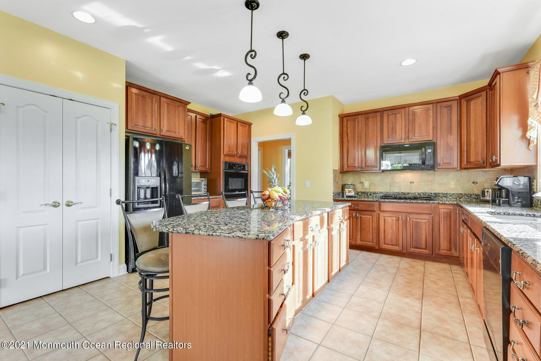 3 Great Bridge Road Freehold, NJ 07728 - Photo 10 of 40 a large kitchen with stainless steel appliances granite countertop a stove refrigerator and a view of living room