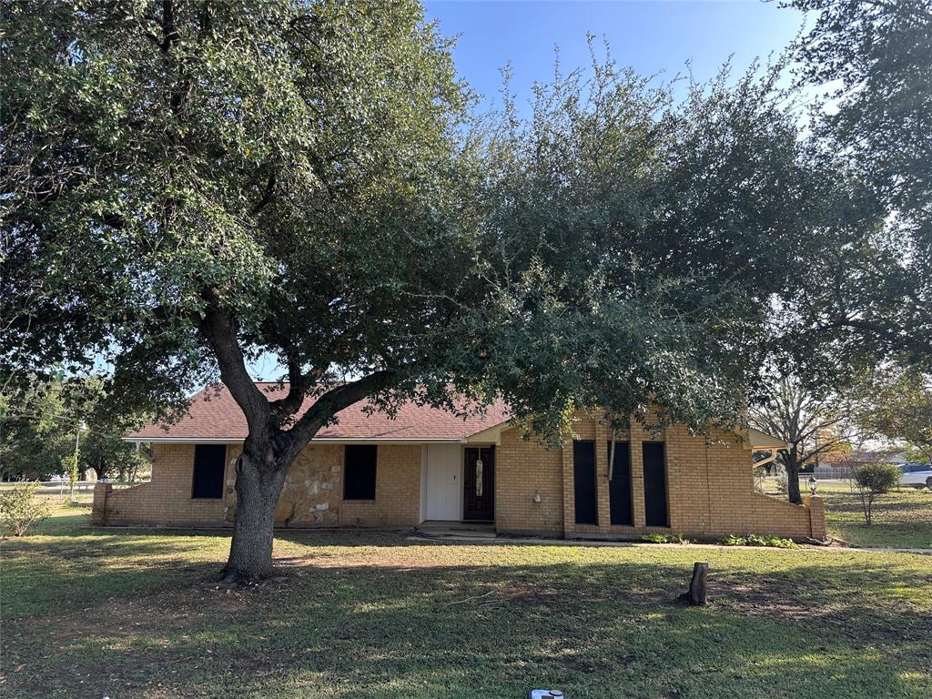 front view of a house with a yard