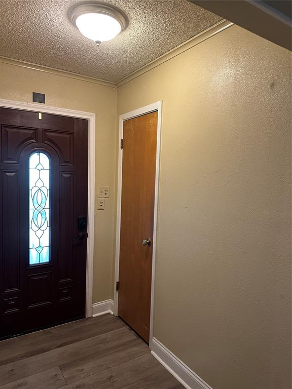 137 Oakview Circle Waco, TX 76705 - Photo 16 of 35 an empty room with wooden floor mirror and windows