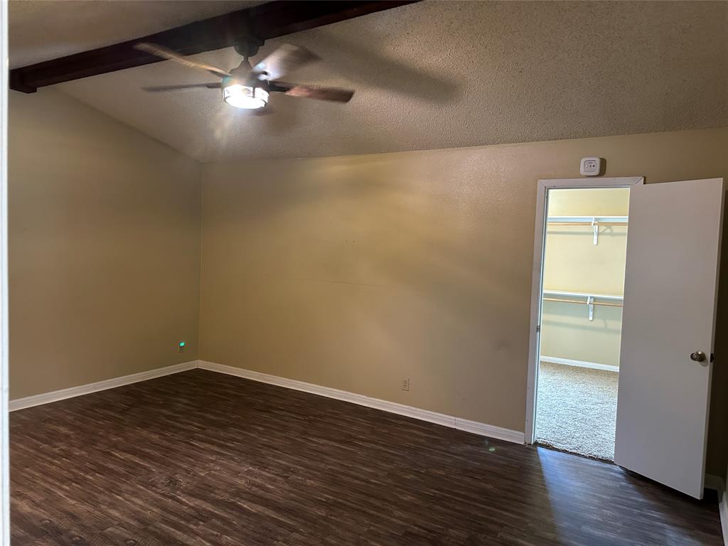 137 Oakview Circle Waco, TX 76705 - Photo 20 of 35 a view of an empty room with wooden floor and a ceiling fan