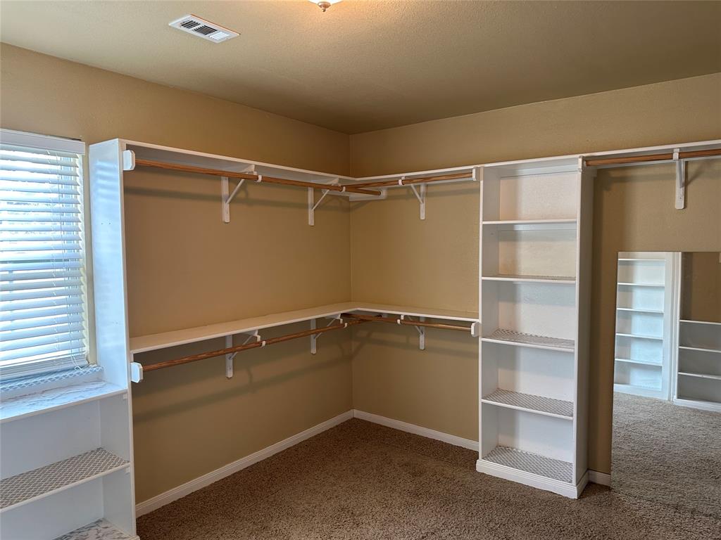 137 Oakview Circle Waco, TX 76705 - Photo 21 of 35 a view of an empty walk in closet