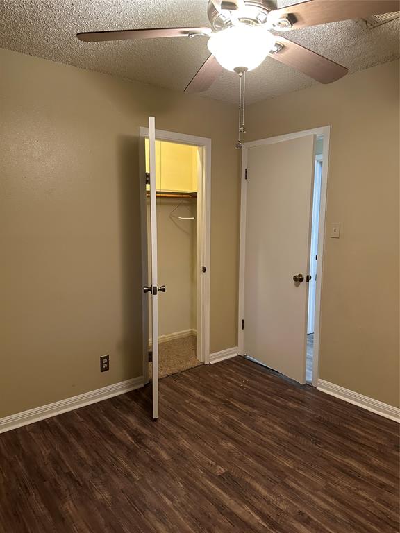 137 Oakview Circle Waco, TX 76705 - Photo 28 of 35 an empty room with wooden floor and a ceiling fan