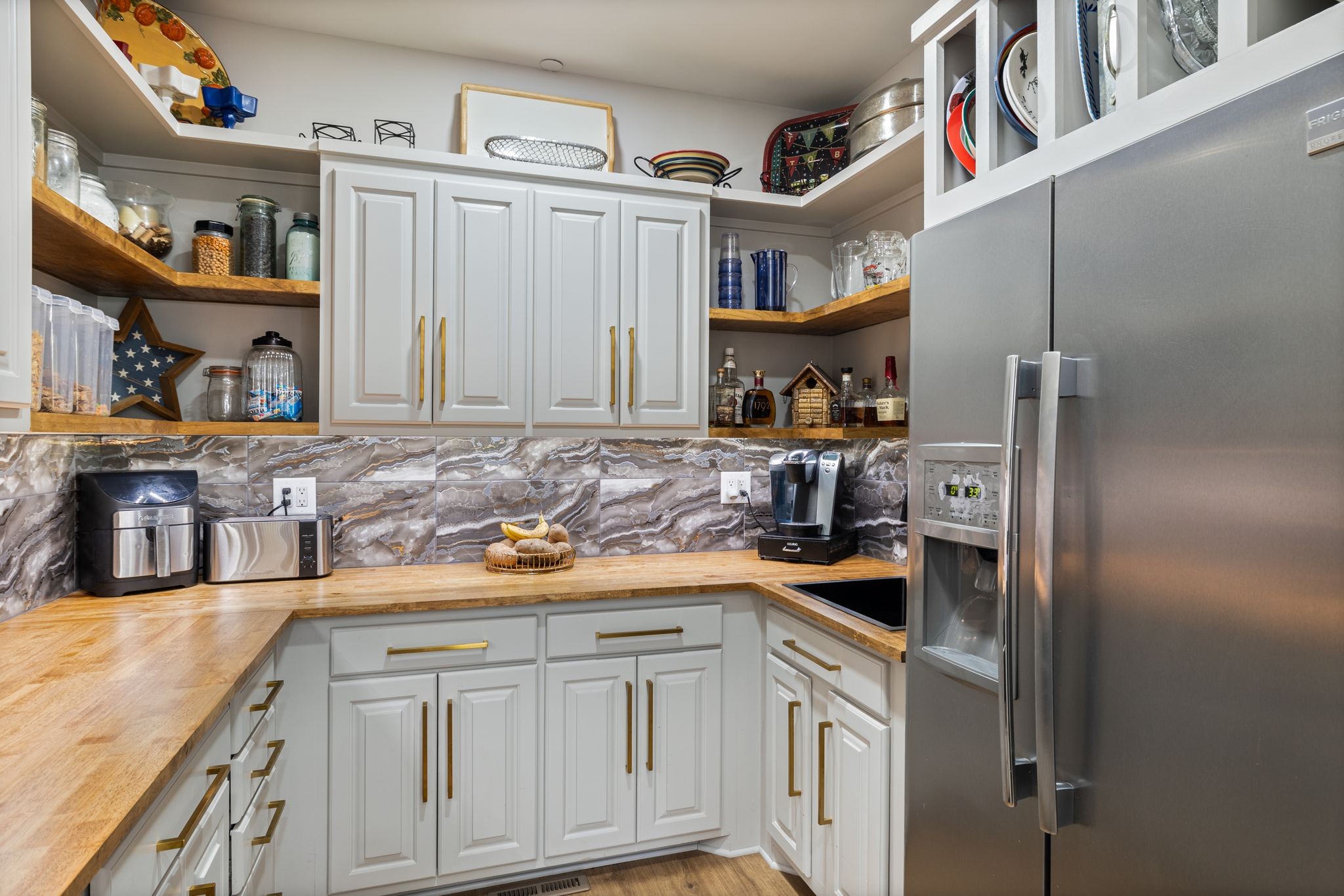 4024 Campania Strada Spring Hill, TN 37174 - Photo 20 of 53 a kitchen with stainless steel appliances granite countertop a sink and cabinets
