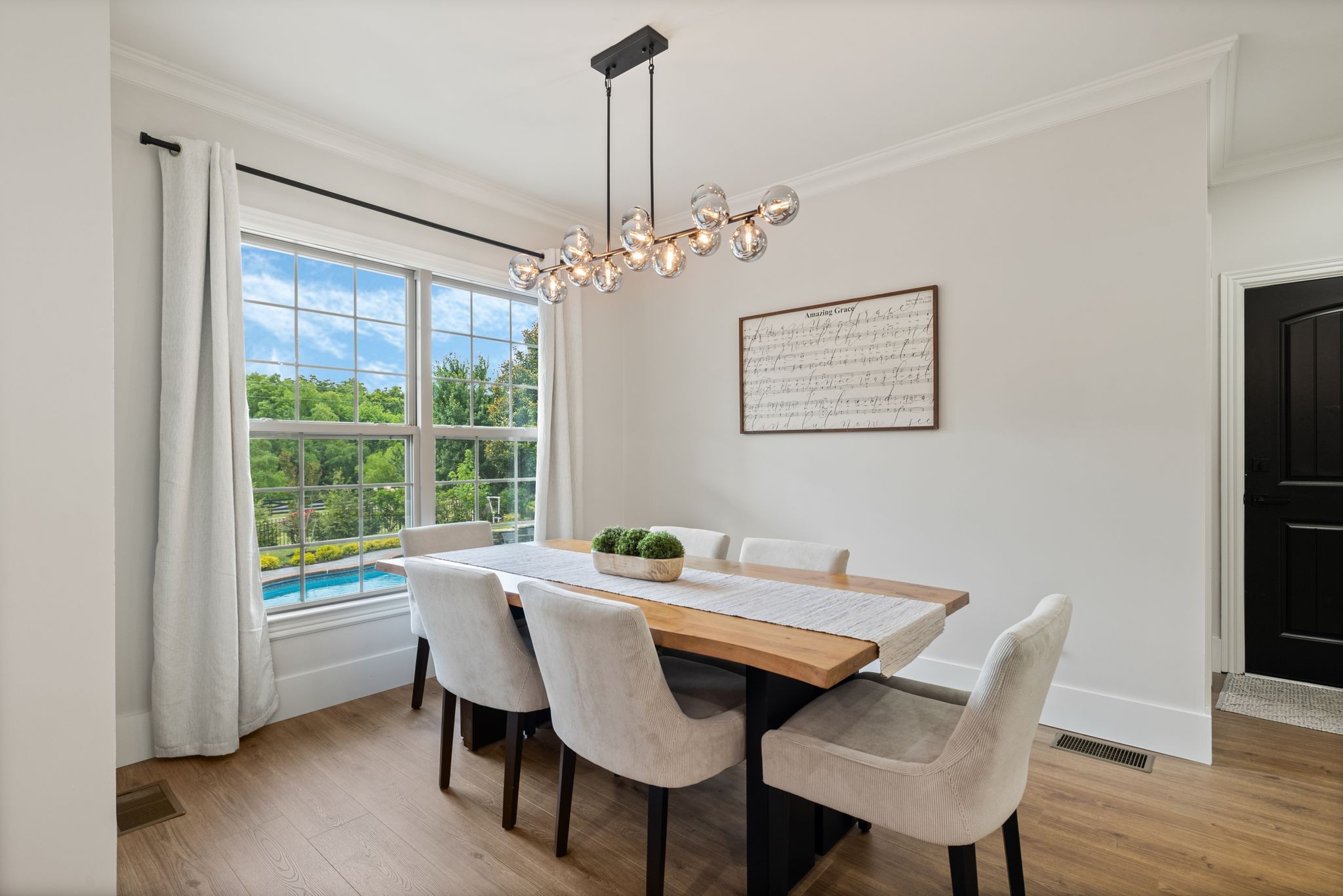 4024 Campania Strada Spring Hill, TN 37174 - Photo 23 of 53 a view of a dining room with furniture window and wooden floor