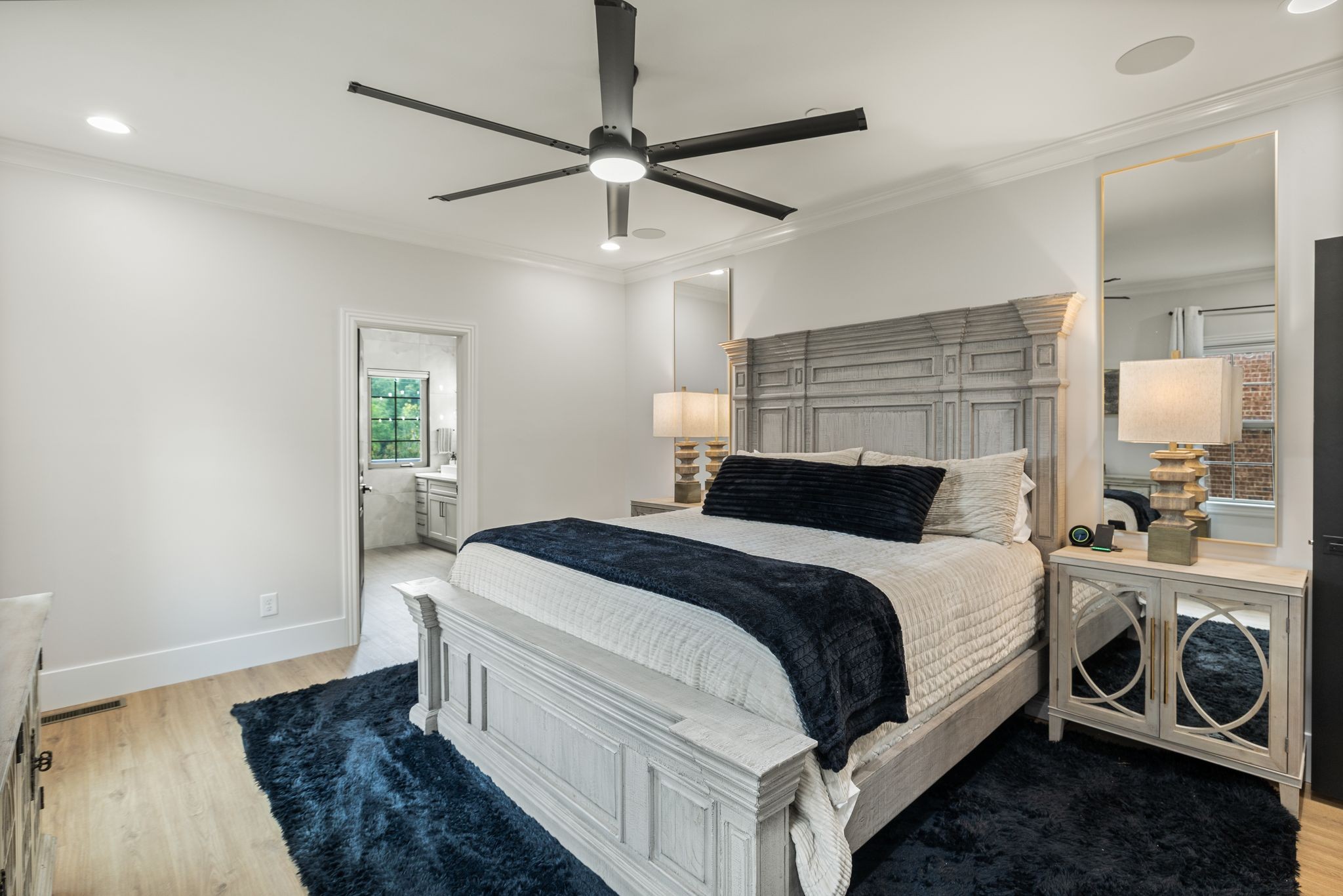 4024 Campania Strada Spring Hill, TN 37174 - Photo 30 of 53 a bedroom with a bed and a chandelier