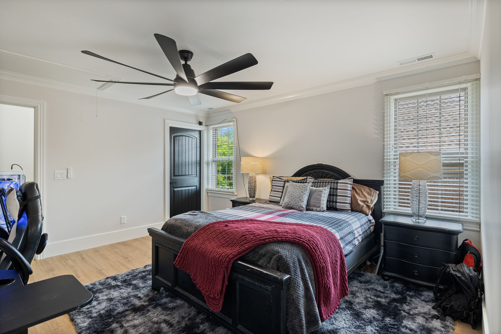 4024 Campania Strada Spring Hill, TN 37174 - Photo 42 of 53 a bedroom with a bed and a chandelier