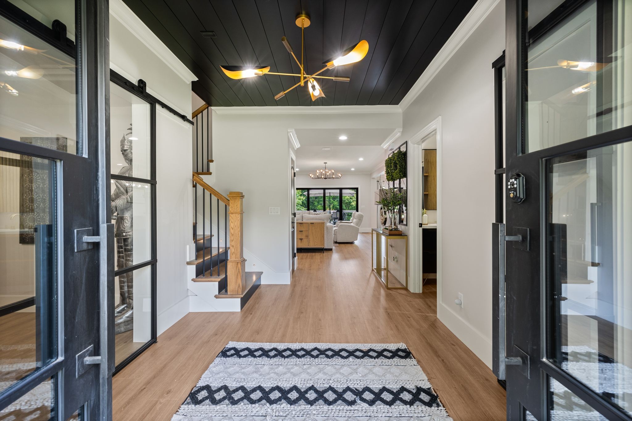 4024 Campania Strada Spring Hill, TN 37174 - Photo 8 of 53 a hallway with a dining table and a stove