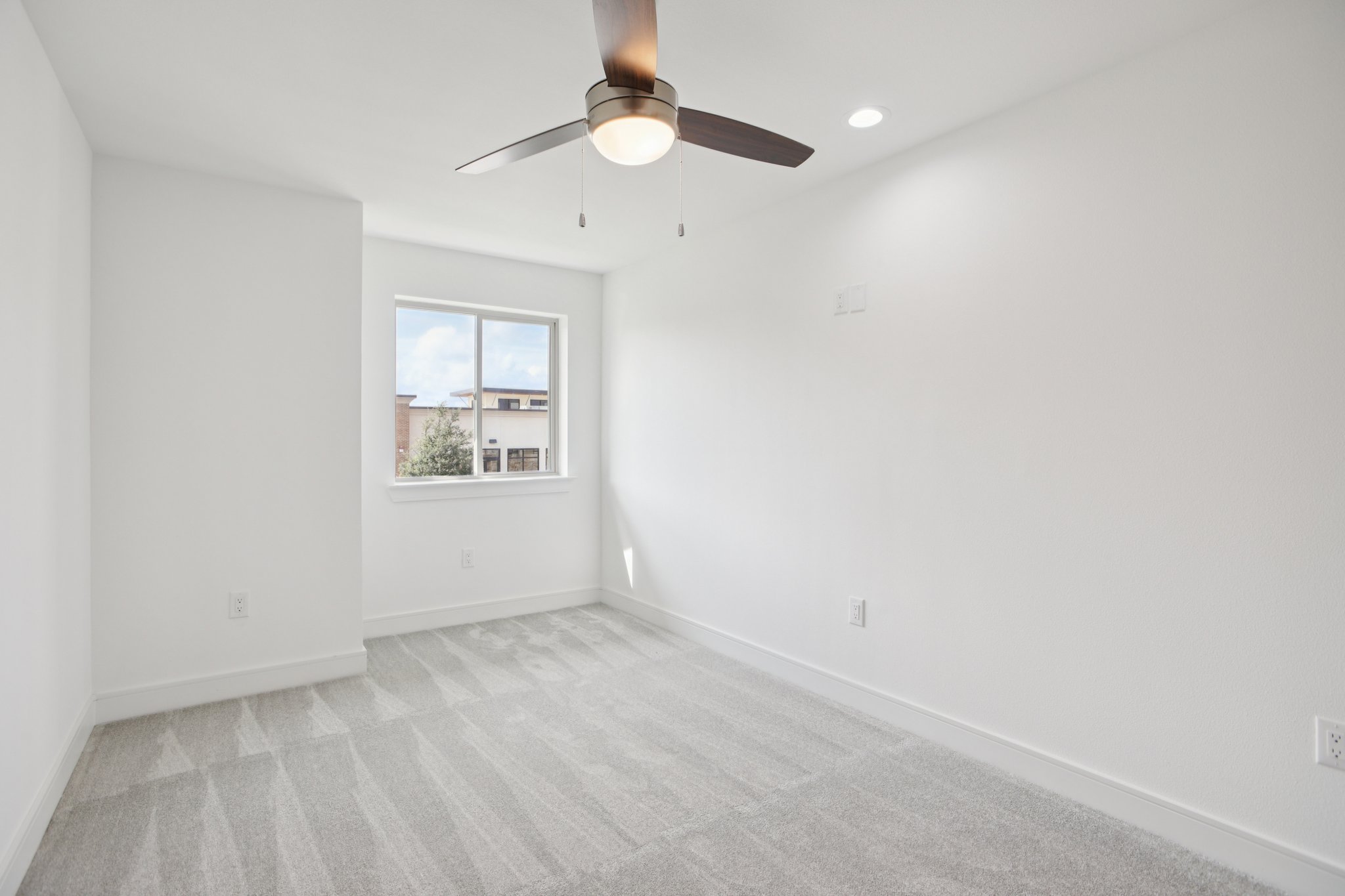 202 Tesla Circle Austin, TX 78681 - Photo 21 of 35 Empty room with light carpet, recessed lighting, and a ceiling fan