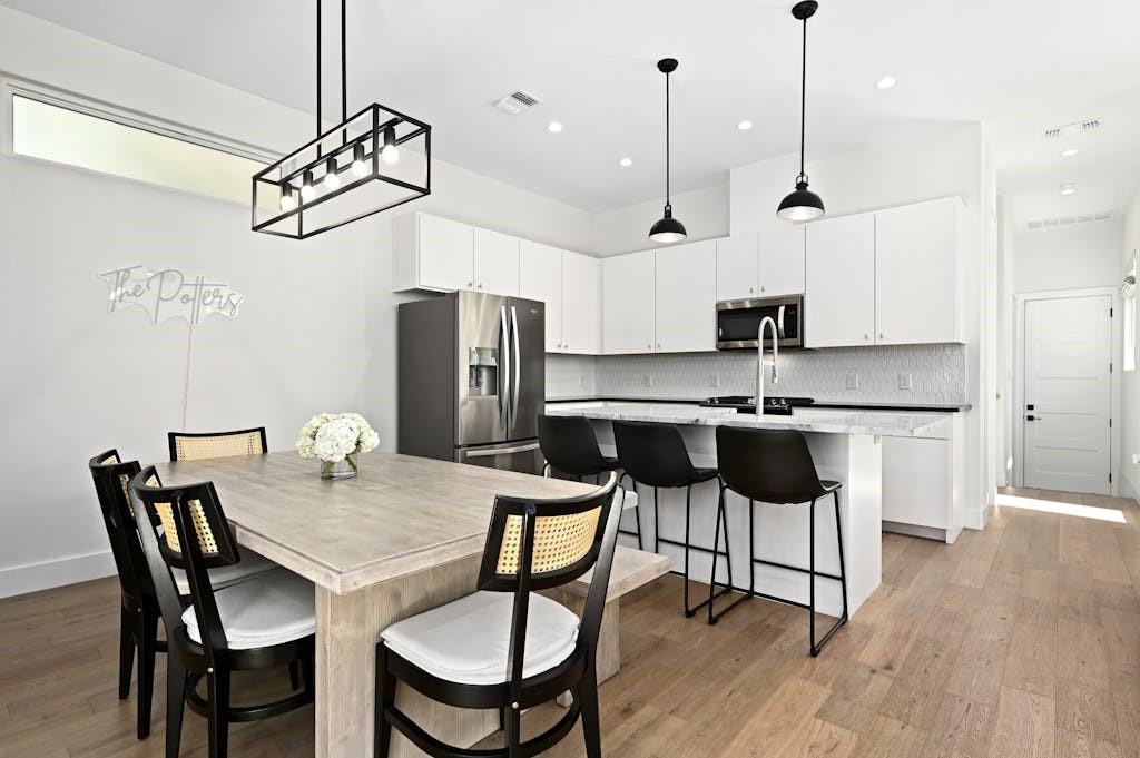 5212 Huisache Street, Unit 2 Austin, TX 78751 - Photo 13 of 30 Dining space with light wood-style flooring and baseboards