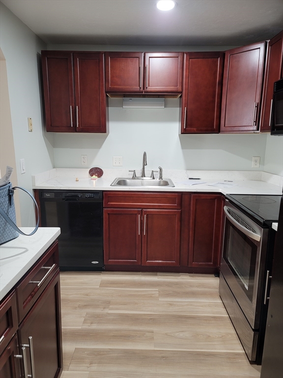7 Gibbs Street, Unit 7 Worcester, MA 01607 - Photo 7 of 20 a kitchen with a sink and a stove top oven