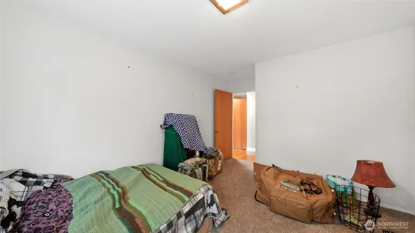 a bedroom with two beds and a window
