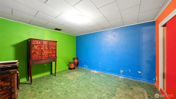 a view of an empty room and a fireplace