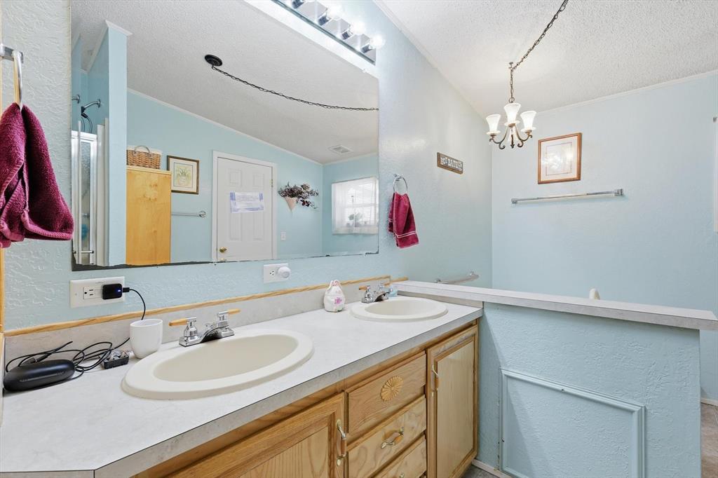 609 Cedar Mills Road Gordonville, TX 76245 - Photo 20 of 38 a bathroom with a sink and a mirror