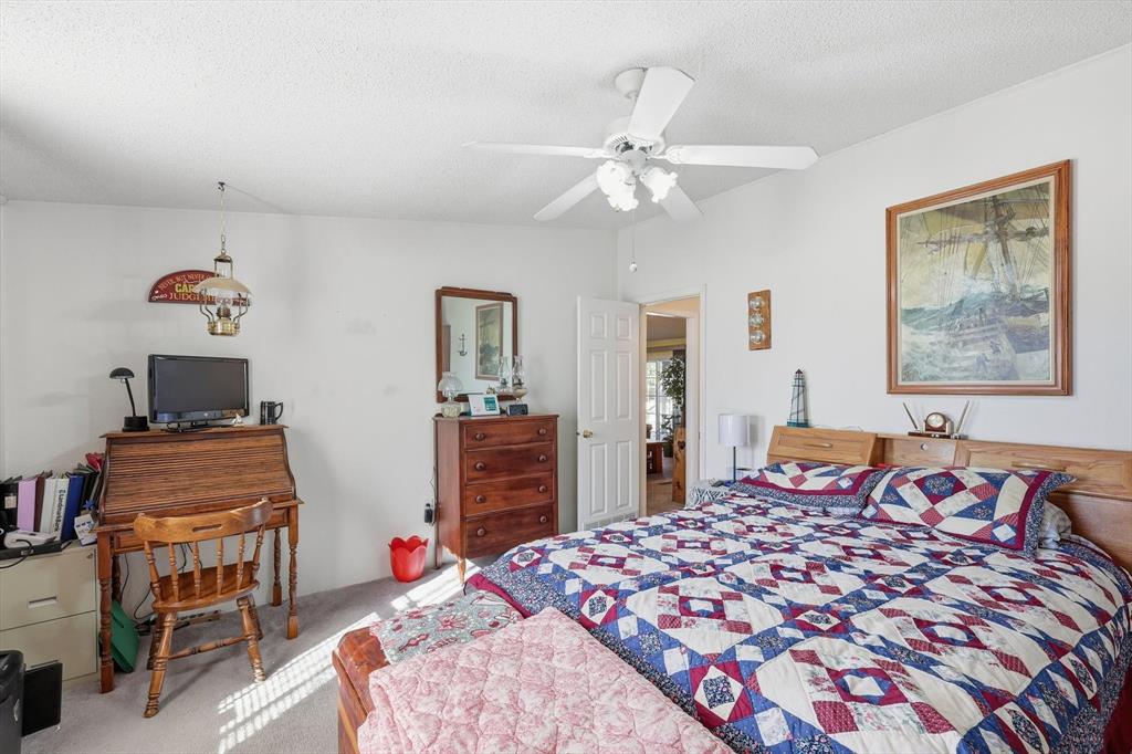 609 Cedar Mills Road Gordonville, TX 76245 - Photo 24 of 38 a bedroom with a bed and a dresser in it