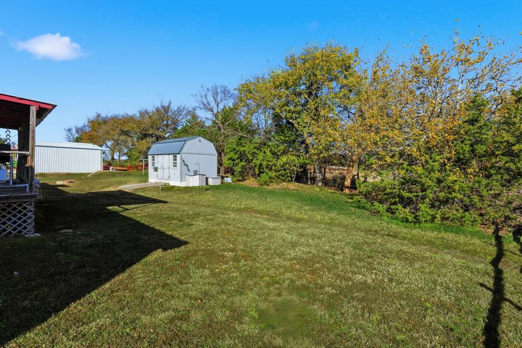 609 Cedar Mills Road Gordonville, TX 76245 - Photo 30 of 38 a view of a house with a yard