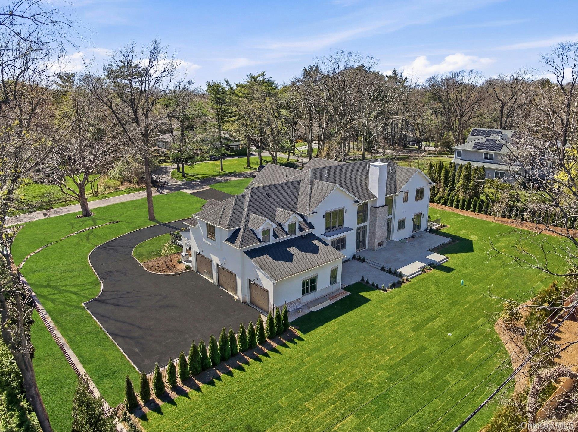 25 West Creek Farms Road Sands Point, NY 11050 - Photo 2 of 39 an aerial view of a house with a big yard