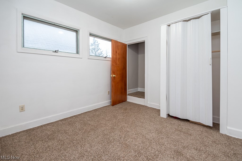 5220 Roseside Avenue Parma, OH 44134 - Photo 13 of 30 Unfurnished bedroom with a closet and light colored carpet