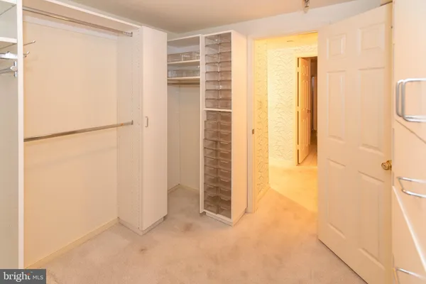 a bathroom with a tub a sink and a shower