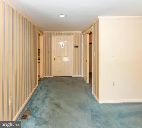 an empty room with closet area