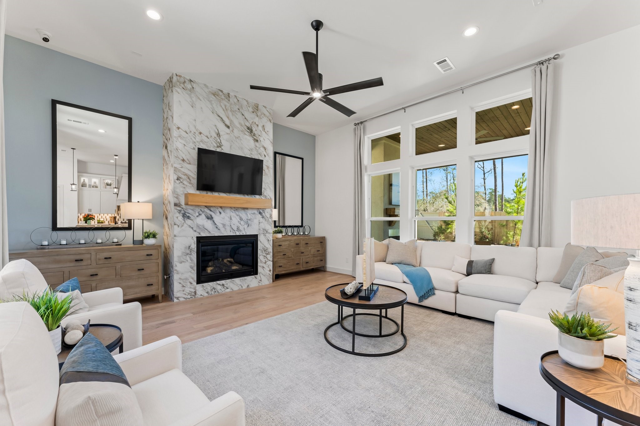 322 Marsh Wren Way Magnolia, TX 77354 - Photo 5 of 19 a living room with furniture a fireplace and a flat screen tv