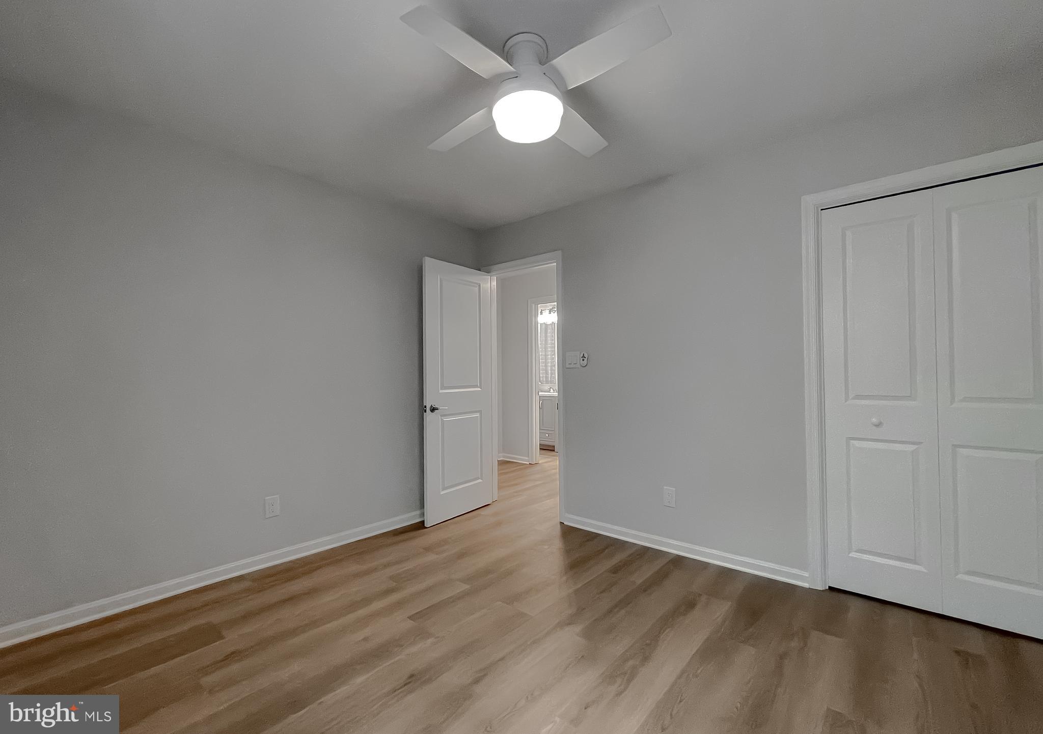 22373 Enoch Road Leonardtown, MD 20650 - Photo 57 of 74 a view of an empty room and wooden floor