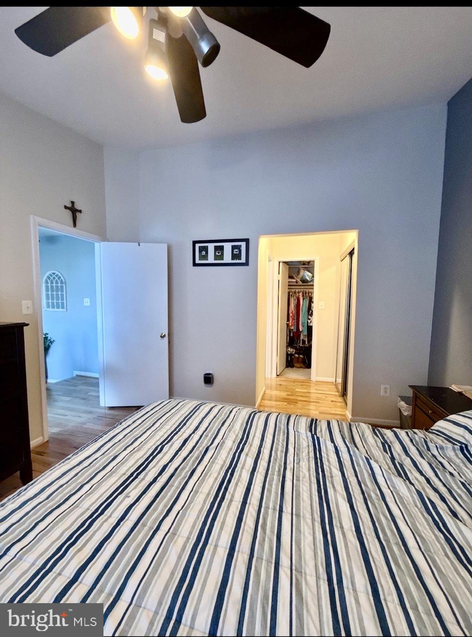 1502 Casino Circle Silver Spring, MD 20906 - Photo 11 of 21 a bedroom with a bed and a large window