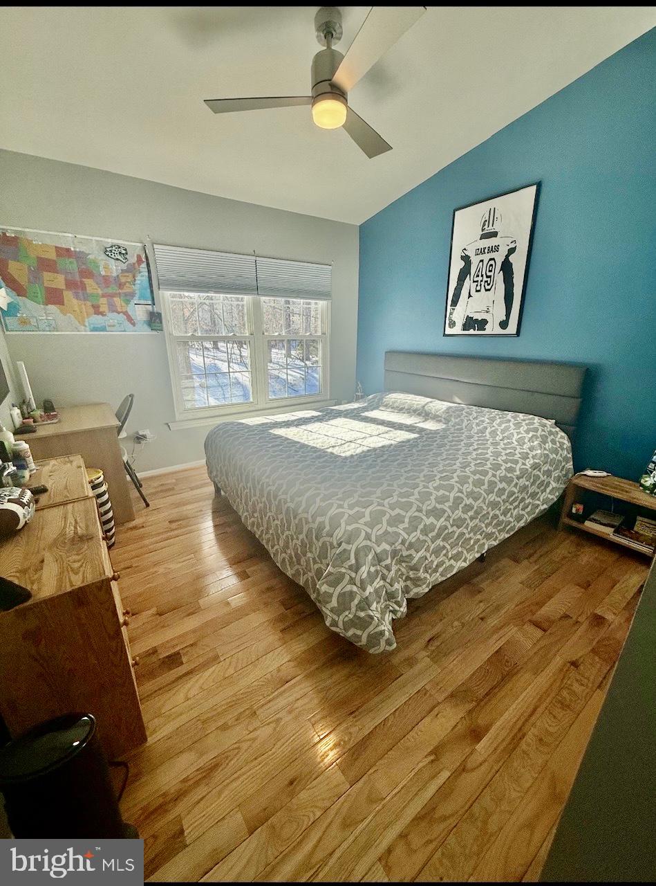 1502 Casino Circle Silver Spring, MD 20906 - Photo 12 of 21 a bed sitting in a bedroom next to a window