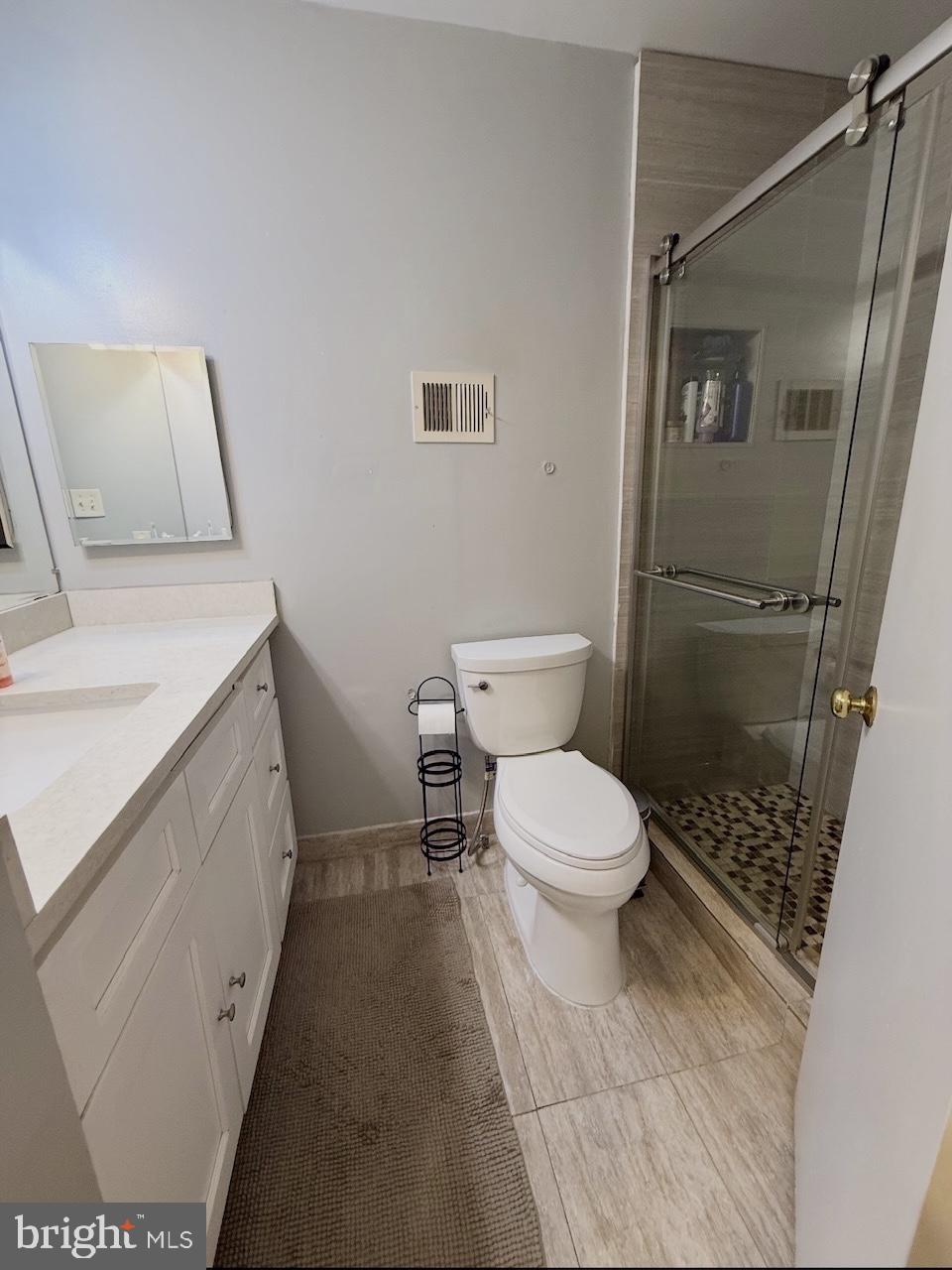 1502 Casino Circle Silver Spring, MD 20906 - Photo 14 of 21 a bathroom with a sink a toilet and shower