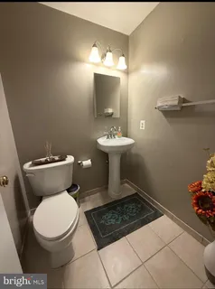 a view of a patio with dining table and chairs