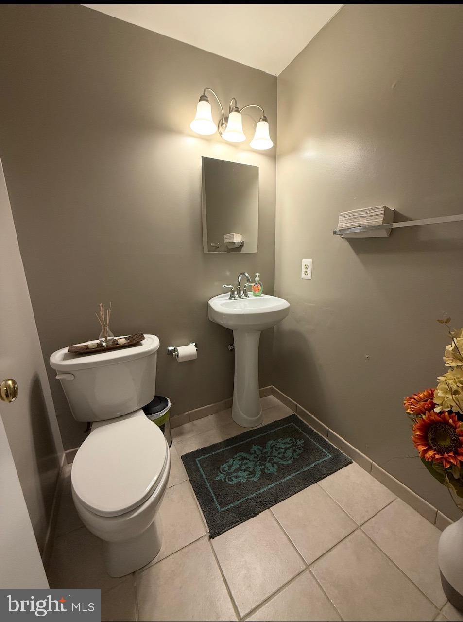 1502 Casino Circle Silver Spring, MD 20906 - Photo 20 of 21 a bathroom with a toilet a sink and mirror