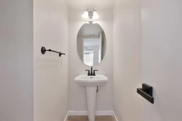 a close view of a sink and a mirror