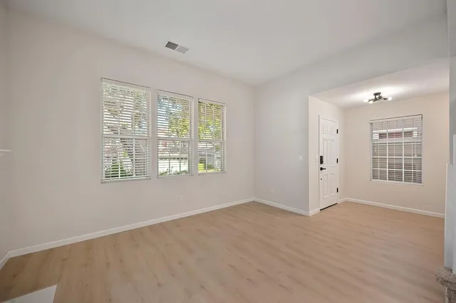 a view of an empty room with a window