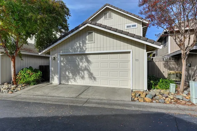 an aerial view of a house with a yard and garden
