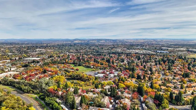 an aerial view of a house with a lake view