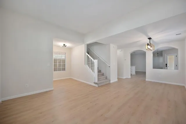 a view of a big room with closet and mirror