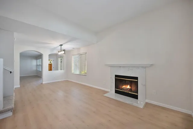 a view of a room fire place and a fireplace