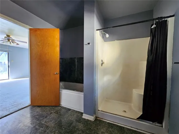 a bathroom with a glass shower door