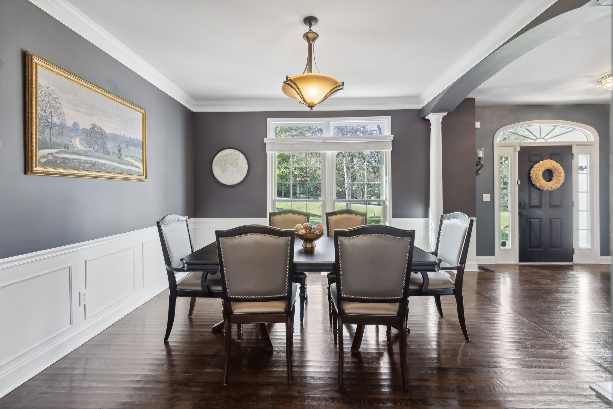 412 Martingale Drive Franklin, TN 37067 - Photo 18 of 56 a dining room with furniture a chandelier and wooden floor