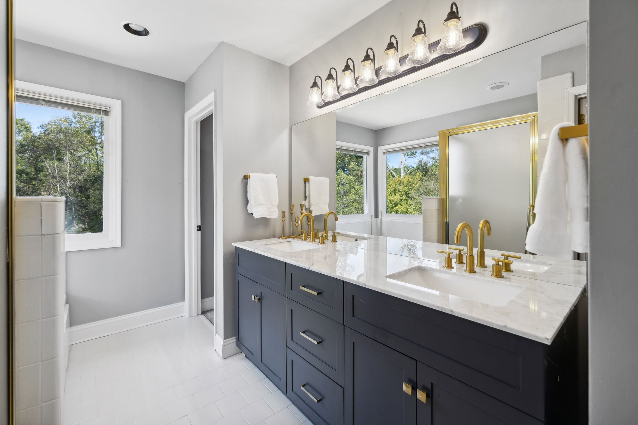 412 Martingale Drive Franklin, TN 37067 - Photo 26 of 56 This Owner's bath has a newly installed Vanity with double sinks and Gold Fixtures! The center drawer stack is so useful!